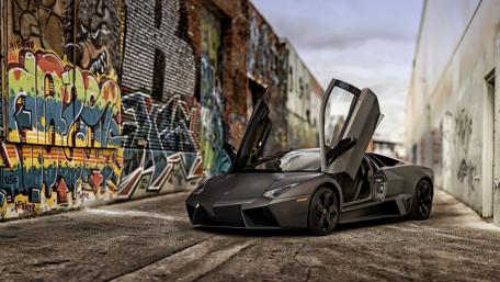 Sleek Lamborghini in Urban Graffiti Setting wallpaper