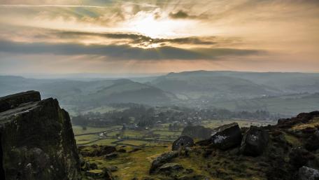 Majestic Sunrise Over Rolling Hills wallpaper