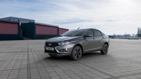 Sleek Silver Sedan in Urban Landscape wallpaper