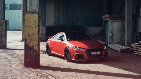 Sleek Red Audi TT in Urban Setting wallpaper