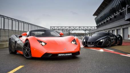 Sleek Marussia Supercars on the Track wallpaper