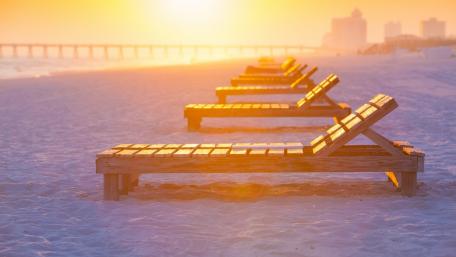 Serene Beachside Loungers at Sunset wallpaper