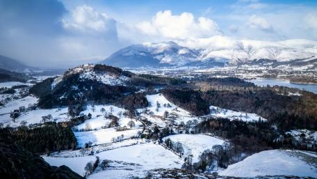 Serene Winter Landscape with Snowy Peaks wallpaper