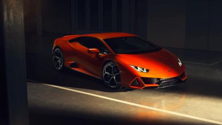 Sleek Lamborghini in a Dramatic Lighting Setting wallpaper