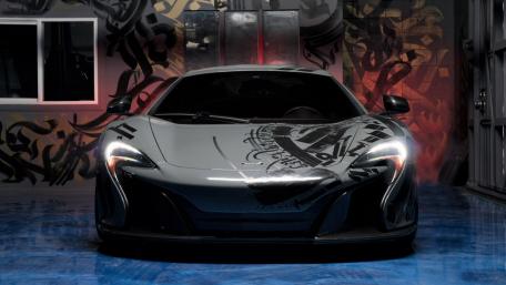 Sleek McLaren in an Urban Graffiti Setting wallpaper