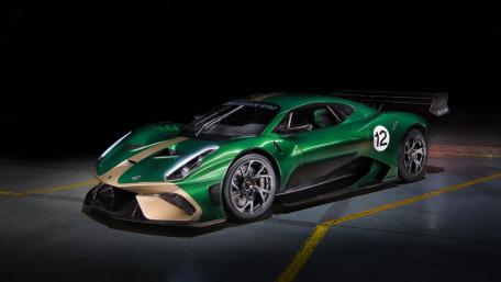 Sleek Green Race Car Wallpaper Design wallpaper