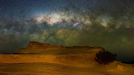 Majestic Milky Way Over Desert Landscape wallpaper