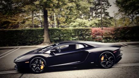 Sleek Black Lamborghini Aventador Wallpaper wallpaper