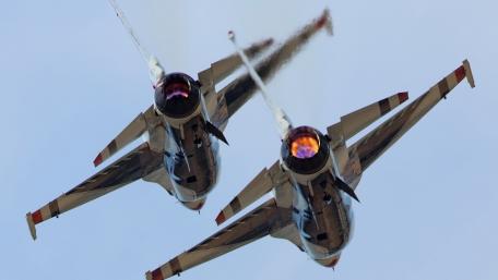 Dynamic Military Jet Maneuvering in Clear Skies wallpaper