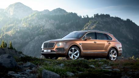 Luxury SUV in Majestic Mountainscape wallpaper