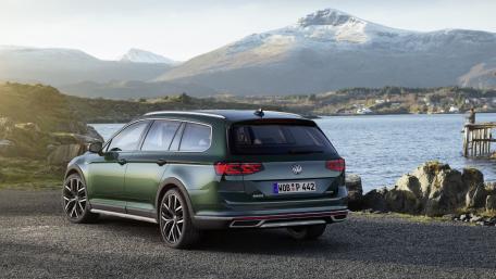 Sleek Volkswagen Station Wagon Against Majestic Mountainscape wallpaper
