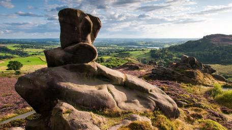 Majestic Rock Formation Overlooking Scenic Landscape wallpaper