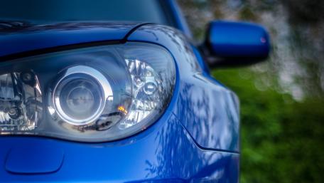 Sleek Blue Car Close-Up Wallpaper wallpaper