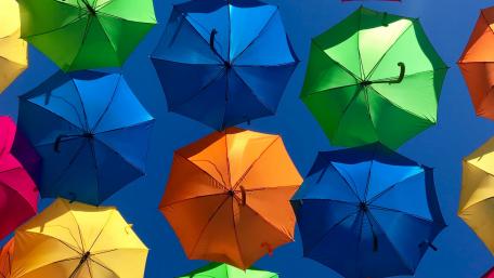 Colorful Umbrellas Against a Clear Sky wallpaper