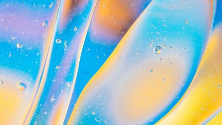 Vibrant Waterdrop Abstract Art Displaying Fluid Shapes and Light Play wallpaper