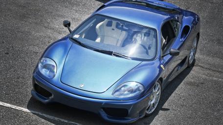 Sleek Blue Sports Car Wallpaper wallpaper