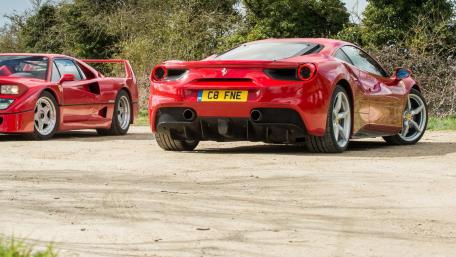 Stunning Red Ferrari Duo in Nature's Embrace wallpaper