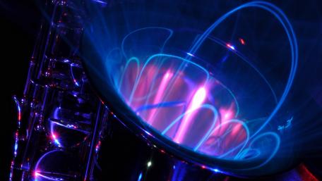 Vibrant Saxophone with Electric Lights Displaying Music Energy wallpaper