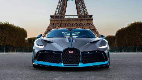 Sleek Bugatti in Front of the Eiffel Tower wallpaper