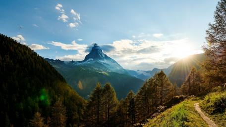 Majestic Mountain Sunrise Over Serene Landscape wallpaper