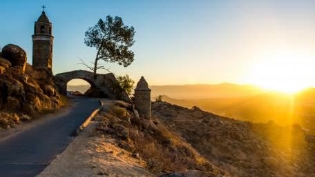 Serene Sunset Over a Rocky Landscape wallpaper