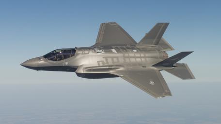 Futuristic Stealth Fighter in Action wallpaper