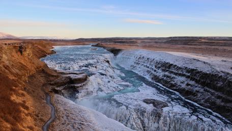 Majestic Waterfall in Winter Landscape wallpaper