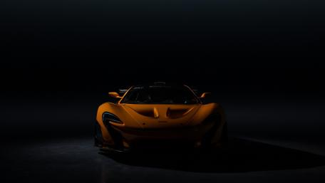 Vibrant Orange Supercar in Dramatic Lighting wallpaper