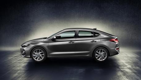 Sleek Modern Sedan in Stylish Setting wallpaper