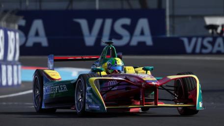 Dynamic Racing Action on Track wallpaper