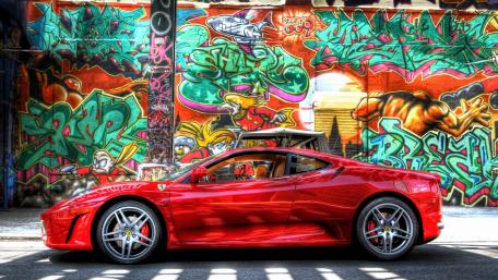 Vibrant Graffiti and Sleek Red Sports Car Wallpaper wallpaper