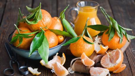 Fresh Oranges and Juice on Rustic Table wallpaper