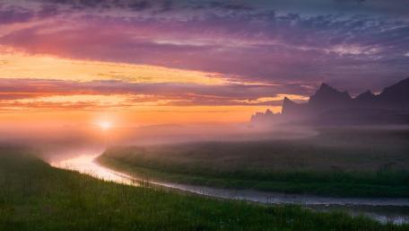 Serene Sunrise Over Misty Valley wallpaper