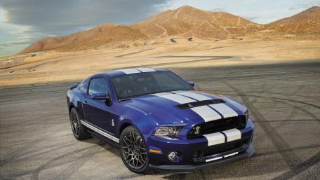 Powerful Blue Muscle Car on a Desert Track wallpaper