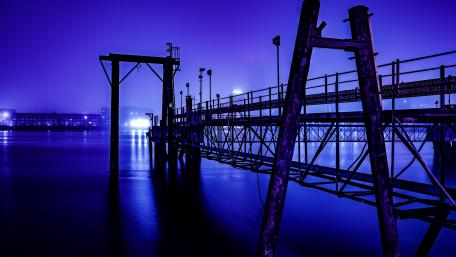 Mysterious Waterfront in Purple Glow wallpaper
