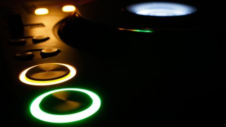 Rhythmic Glow of a DJ's Turntable wallpaper