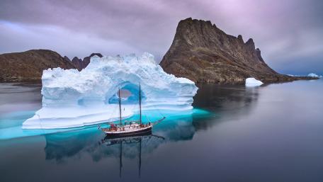 Majestic Reflection of a Sail Ship and Iceberg wallpaper
