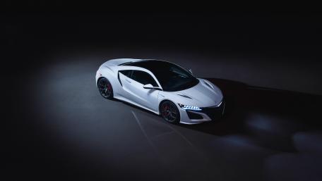 Sleek White Sports Car in Dramatic Lighting wallpaper
