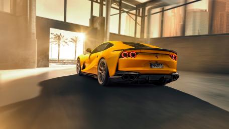 Striking Yellow Sports Car in Urban Setting wallpaper