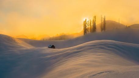 Serene Snowy Landscape at Sunset wallpaper