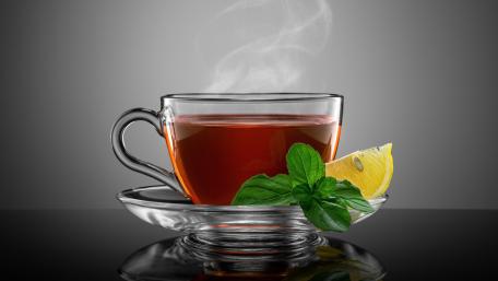 Refreshing Herbal Tea with Lemon Slice and Mint Garnish wallpaper