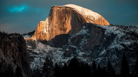 Majestic Mountain Under Glowing Sunrise Light wallpaper