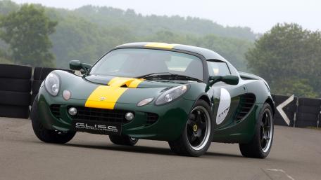Sleek Green Sports Car on the Track wallpaper