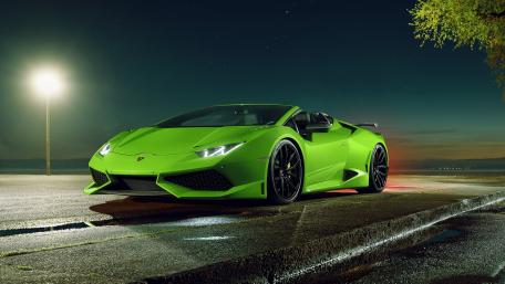 Vibrant Green Supercar Against Night Sky wallpaper