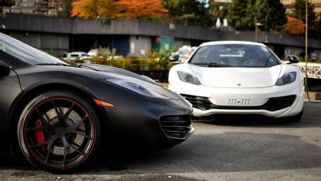 Sleek Performance Cars in Urban Setting wallpaper