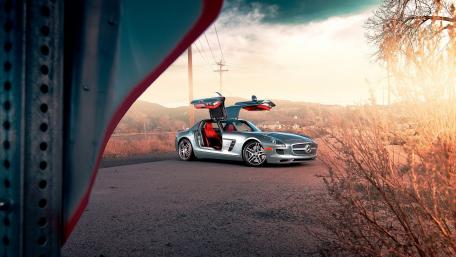 Sleek Silver Sports Car in Nature's Embrace wallpaper
