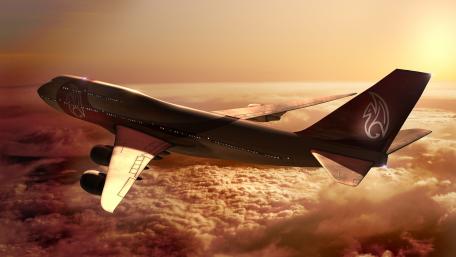 Soaring Through Sunset Skies Above the Clouds wallpaper