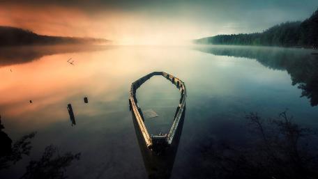 Serene Reflections on a Misty Lake wallpaper