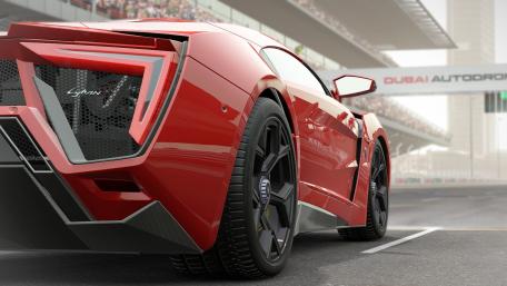 Sleek Red Supercar at Dubai Autodrome wallpaper