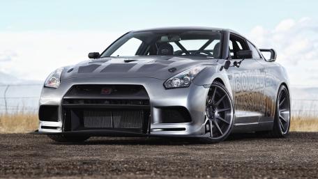 Sleek Performance Car in Stunning Landscape wallpaper